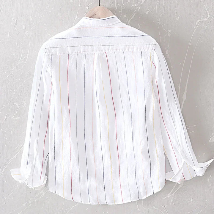 Back view of white long-sleeve shirt with red, yellow, and navy vertical stripes on hanger