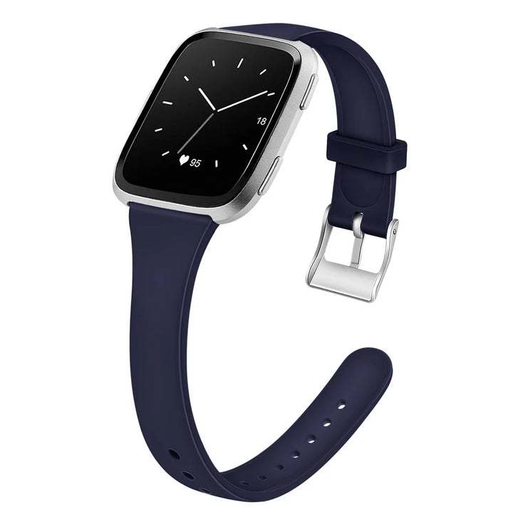 smartwatch with navy blue silicone band and silver case showing analog time and heart rate