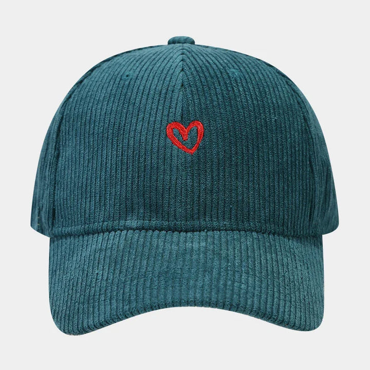 Teal corduroy baseball cap with a small red embroidered heart on front