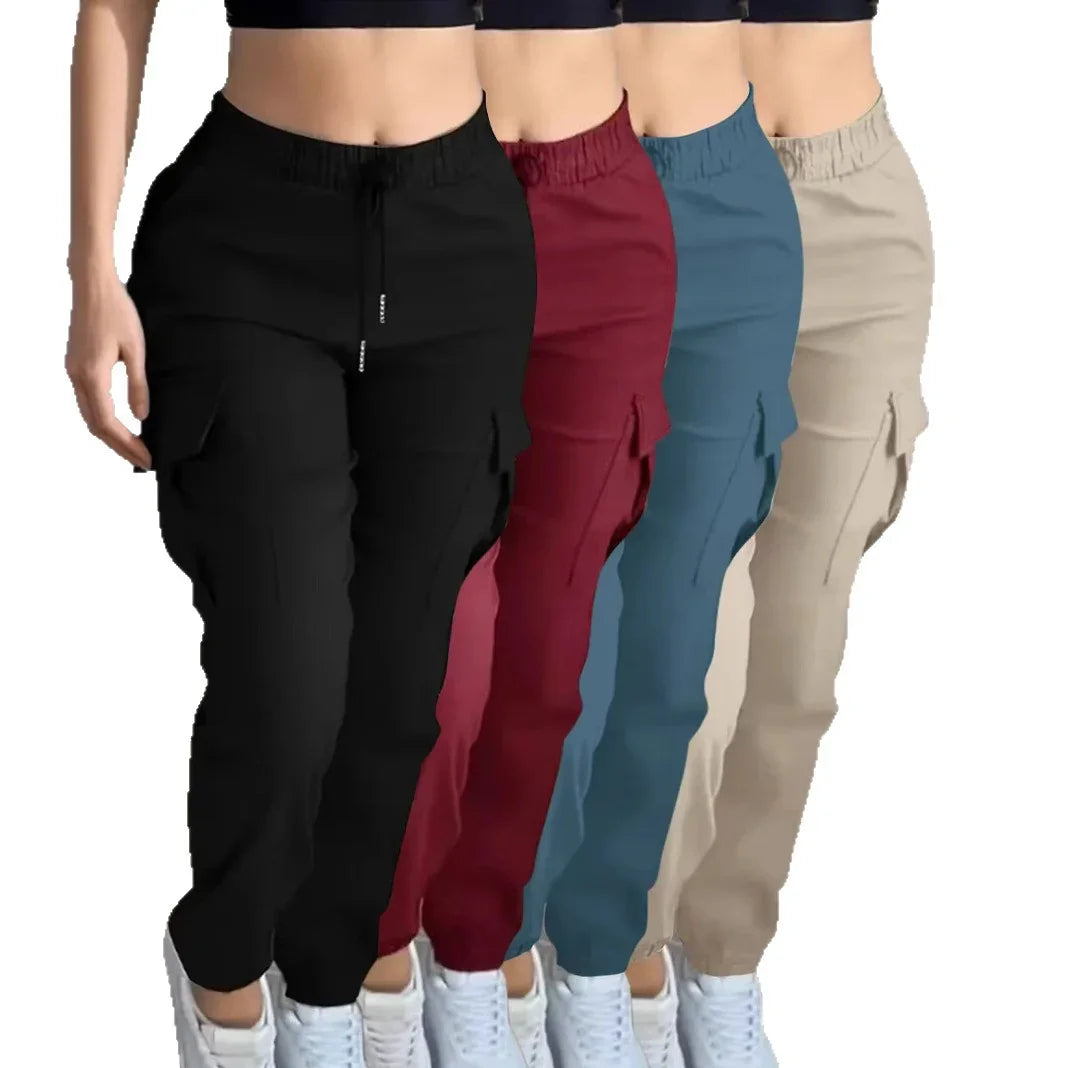 Four women's cargo pants in black, maroon, blue, and beige with elastic waist and white sneakers