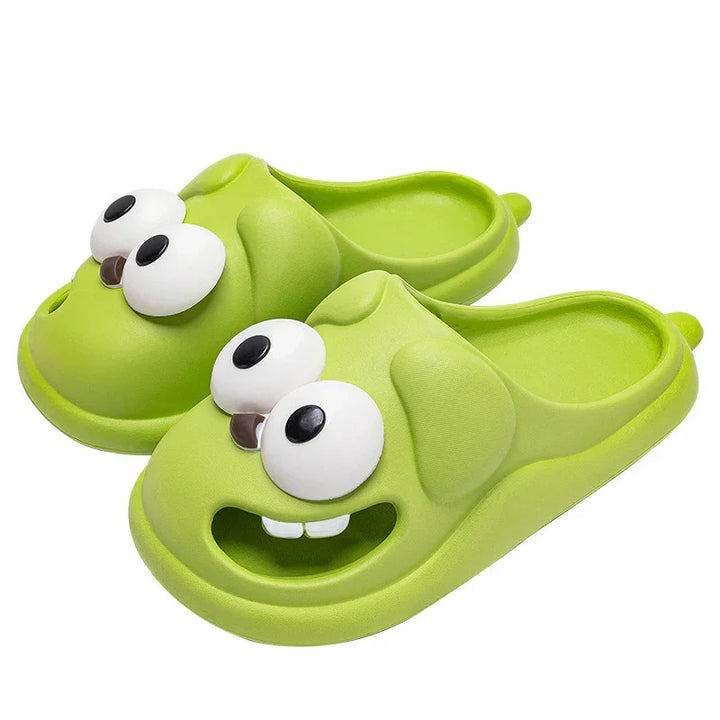 Green cartoon frog slippers with big eyes and smiling mouth, soft foam material, casual indoor footwear