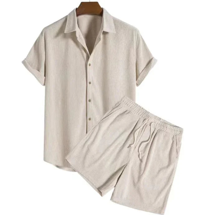 Beige short-sleeve button-up shirt and elastic waist shorts set on white background