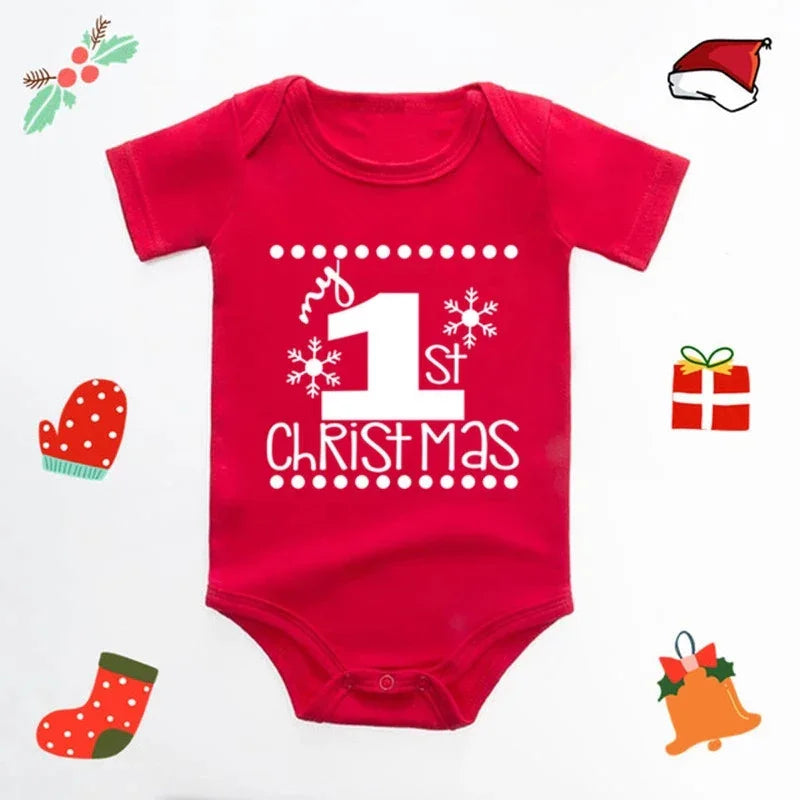 Red baby onesie with white text reading My 1st Christmas, decorated with snowflakes and festive icons
