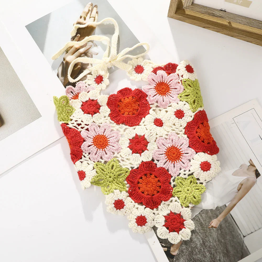 Colorful crochet flower tank top with red, pink, white, and green floral patterns on white background