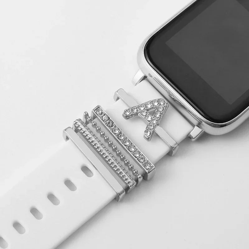 Smartwatch with white silicone band decorated with silver and rhinestone alphabet letter A charm and metallic accents