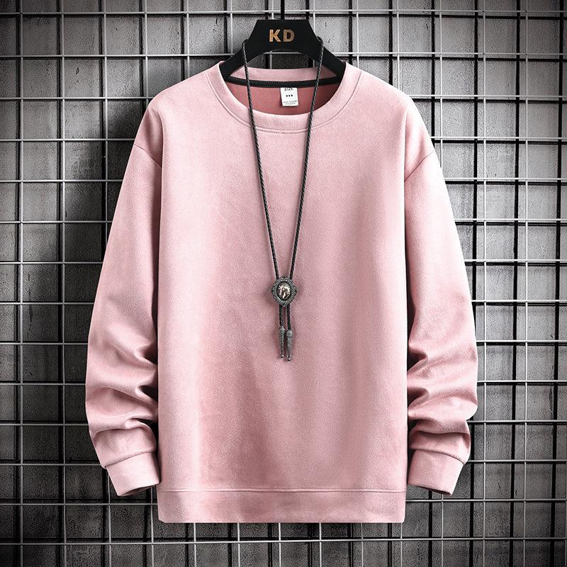 Soft pink crewneck sweatshirt hanging on KD branded hanger with black bolo tie against metal grid background