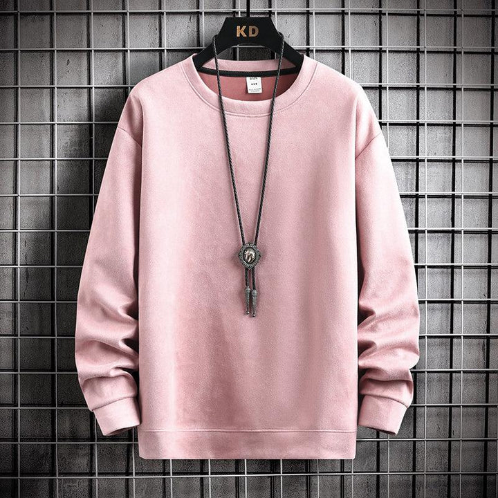 Soft pink crewneck sweatshirt hanging on KD branded hanger with black bolo tie against metal grid background