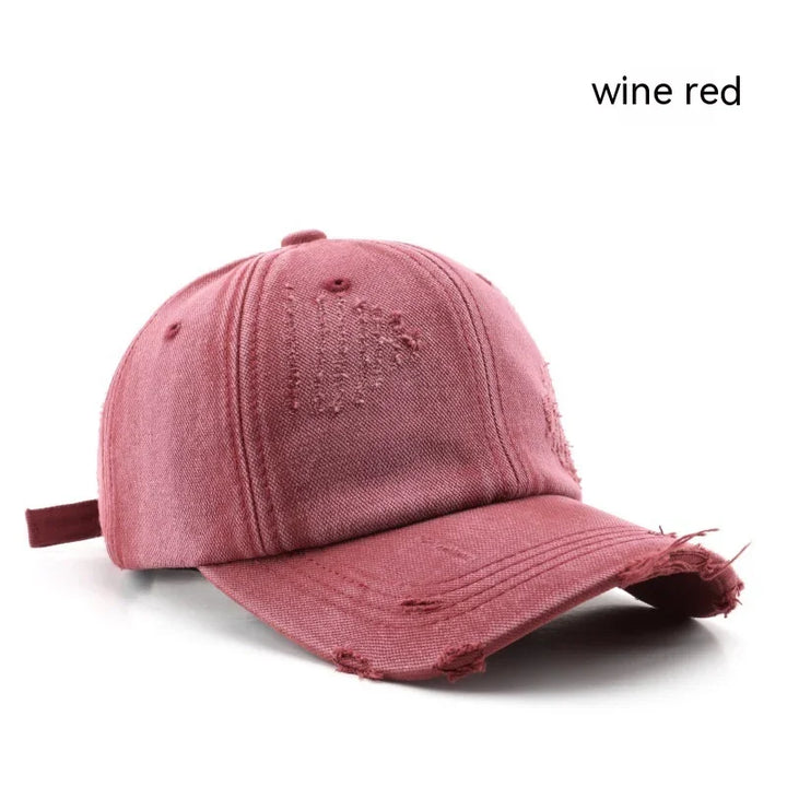 Wine red distressed baseball cap with curved brim and embroidered details