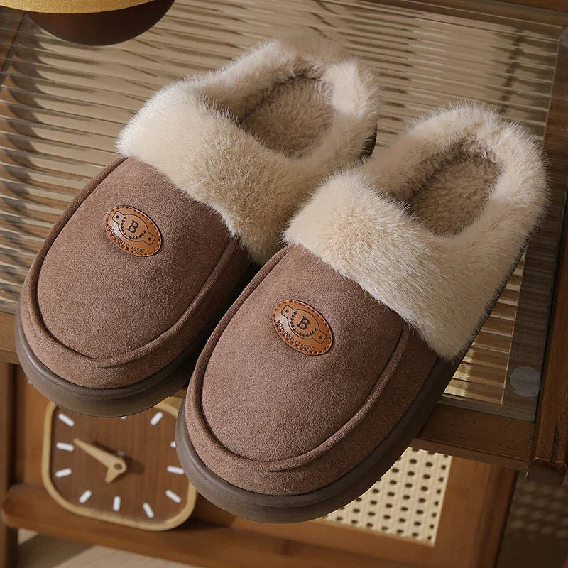 Brown cozy slippers with fluffy beige fur lining on a wooden table near a vintage clock