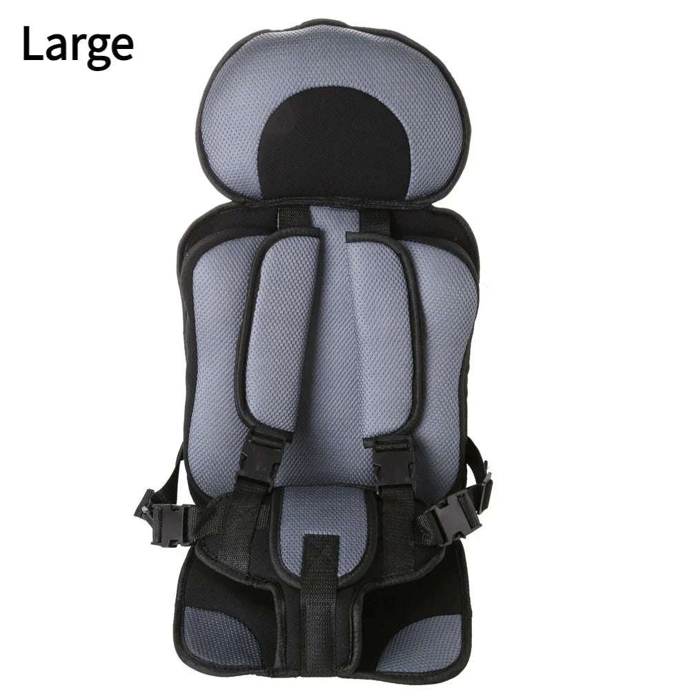 Large gray and black padded child safety harness seat with adjustable straps and buckles