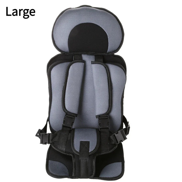 Large gray and black padded child safety harness seat with adjustable straps and buckles