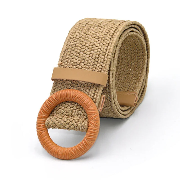 Beige woven fabric belt with round tan leather buckle on white background