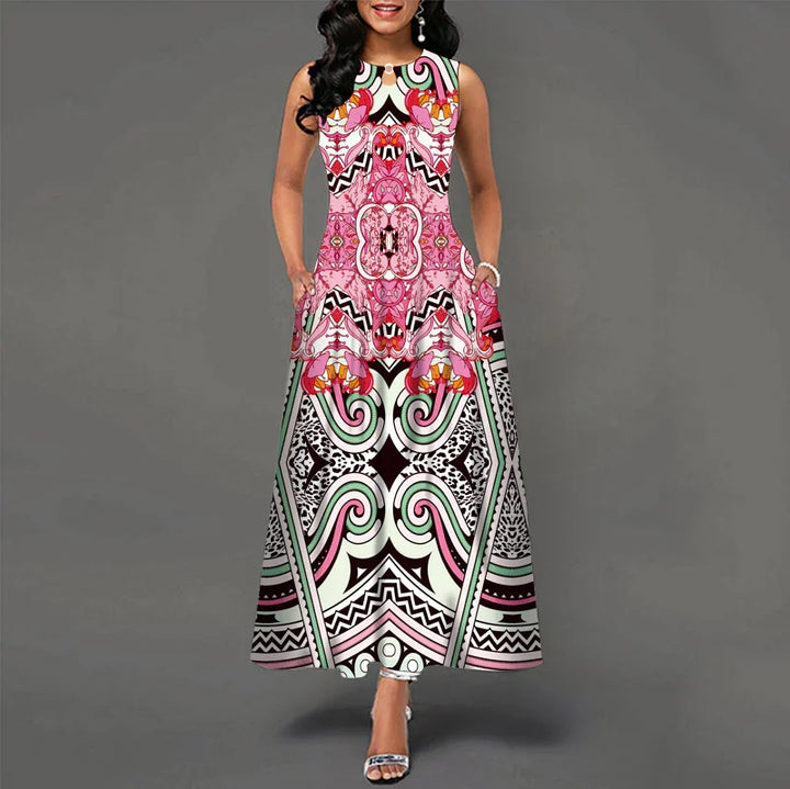 Woman wearing sleeveless maxi dress with pink and black abstract geometric floral pattern