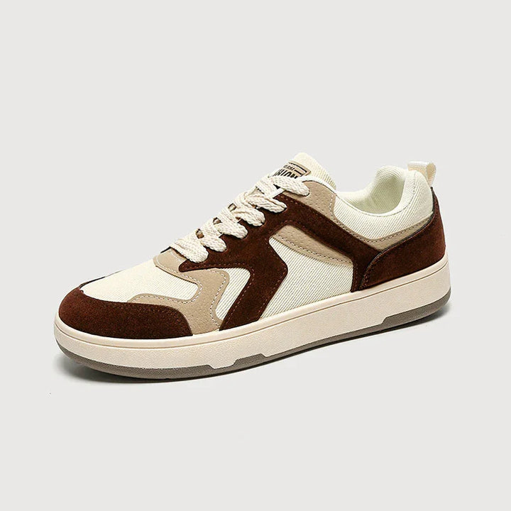 Brown and beige casual sneaker with white laces and a beige sole on gray background