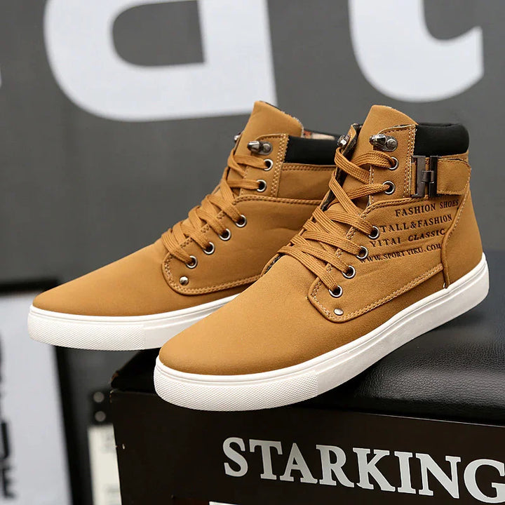 Brown high-top casual sneakers with white soles and metal eyelets on black box