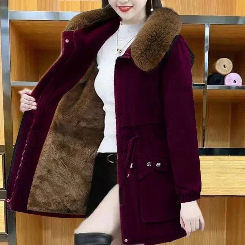 woman wearing stylish dark purple winter coat with faux fur collar and warm brown lining
