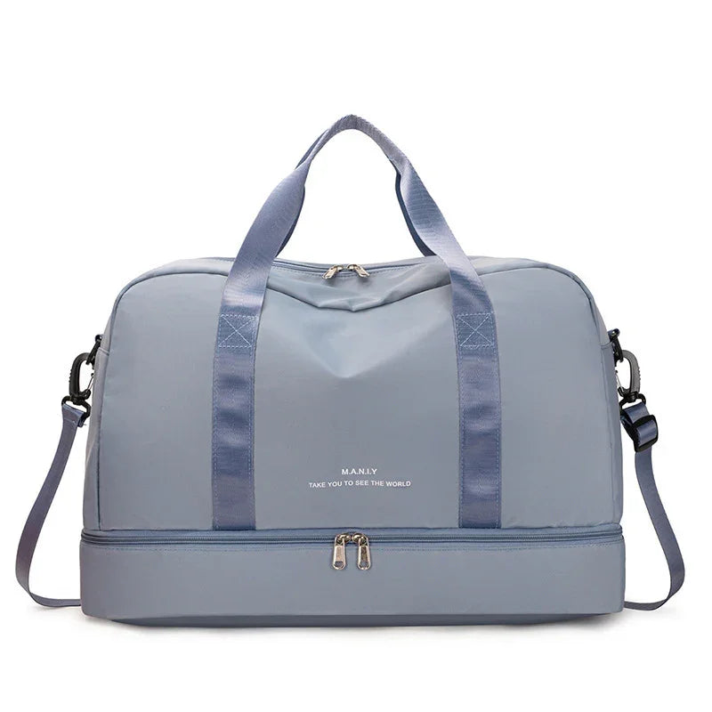 Light blue travel duffel bag with detachable shoulder strap and bottom zipper compartment