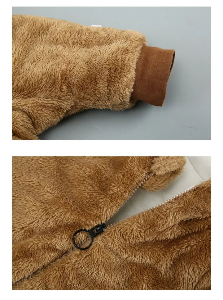 Close-up of brown fuzzy fleece jacket sleeve and black zipper on soft textured fabric