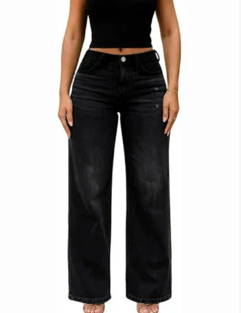 Woman wearing high-waisted wide-leg black jeans and a black cropped top on white background
