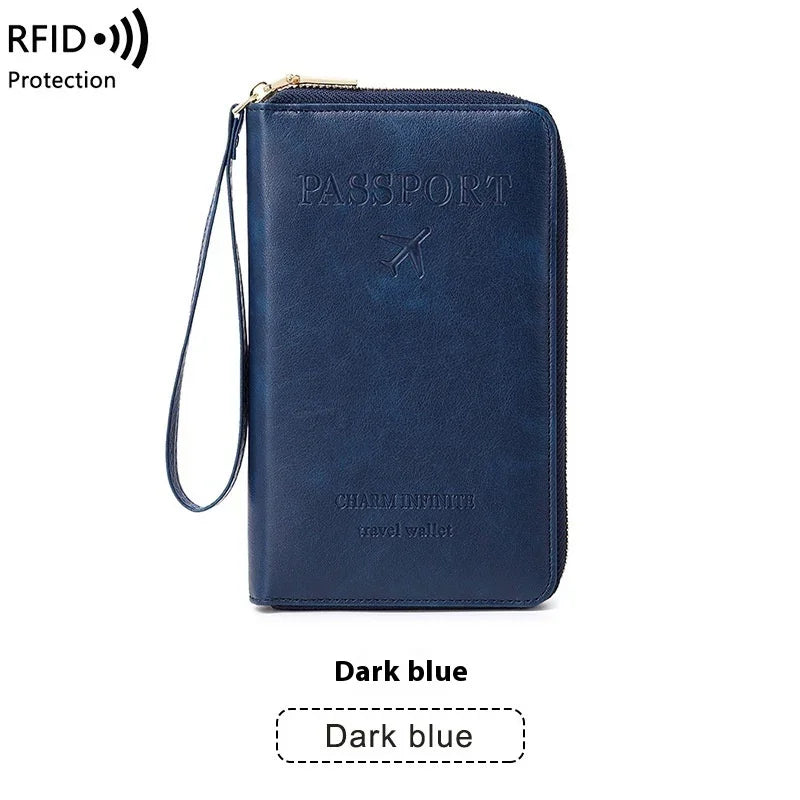 Dark blue RFID blocking travel passport wallet with wrist strap and embossed airplane design
