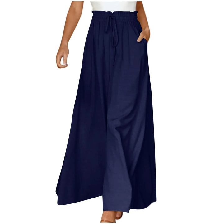 Woman wearing navy blue wide leg palazzo pants with drawstring waist and pockets