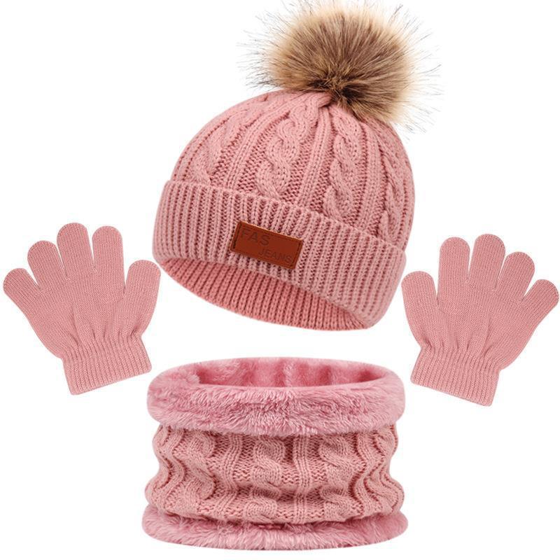 Pink winter set with cable knit beanie hat with faux fur pompom, matching gloves, and soft fleece neck warmer