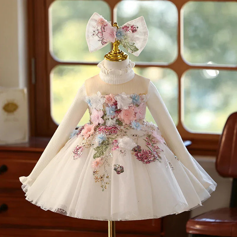 White baby girl dress with floral embroidery and matching flower bow headband on mannequin