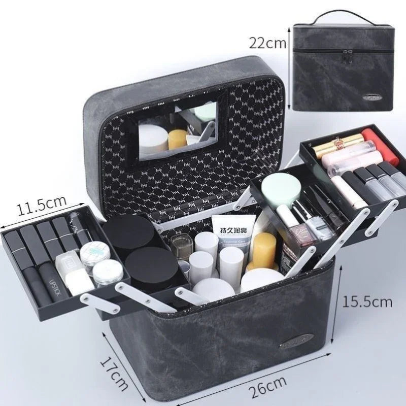 Black leather makeup organizer box with extendable trays, mirror, and various cosmetics inside