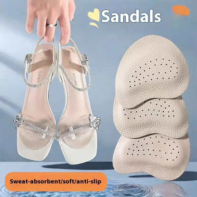 Hand holding transparent strap sandals with butterfly detail and beige sweat-absorbent insoles