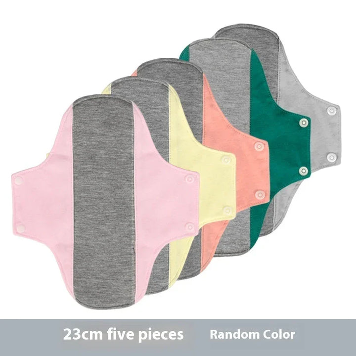 Set of five 23cm reusable cloth menstrual pads in assorted colors with gray centers and side snaps