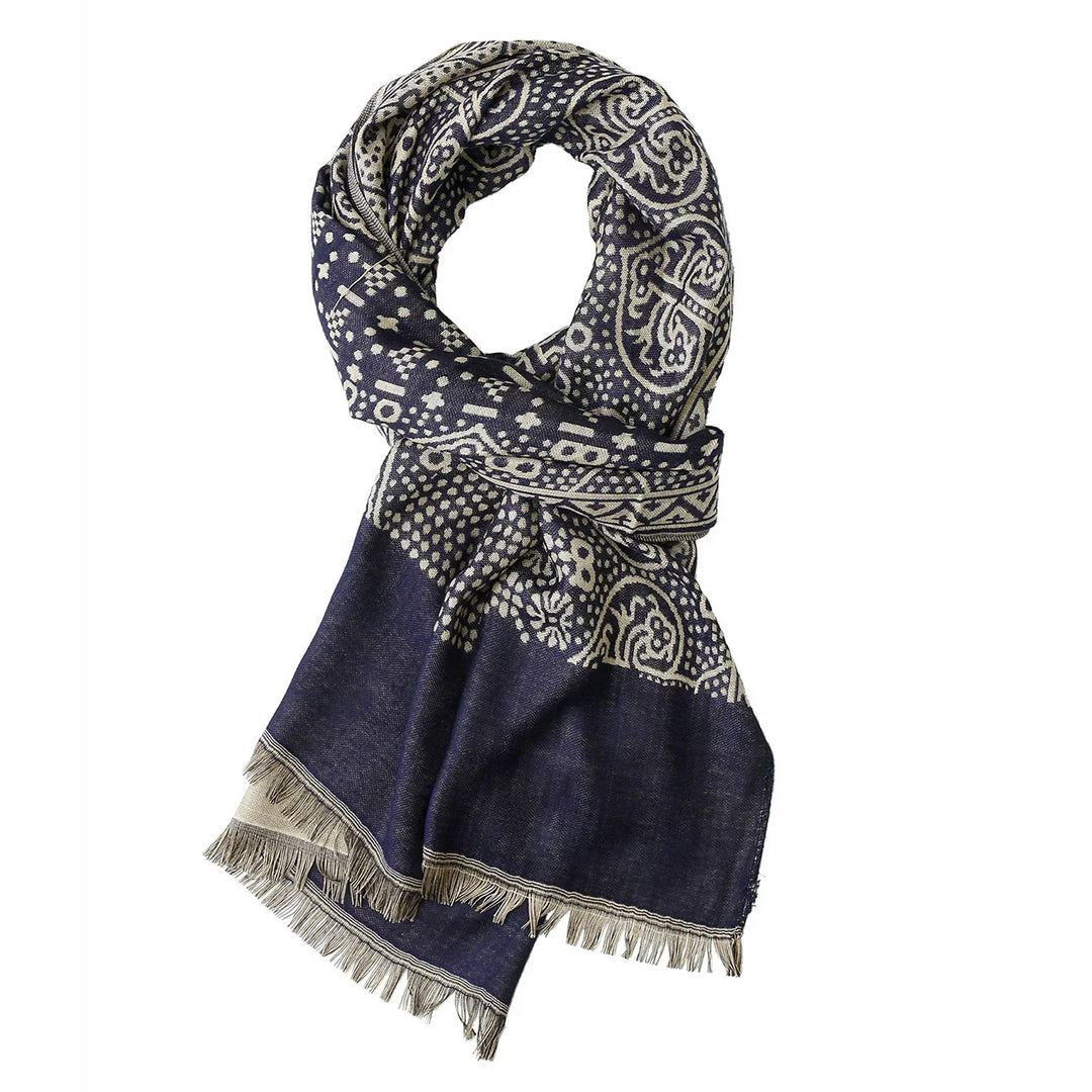 Navy blue scarf with intricate white paisley and polka dot patterns, fringed edges