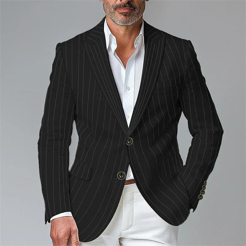 Man wearing black pinstripe blazer with white dress shirt and white pants on gray background