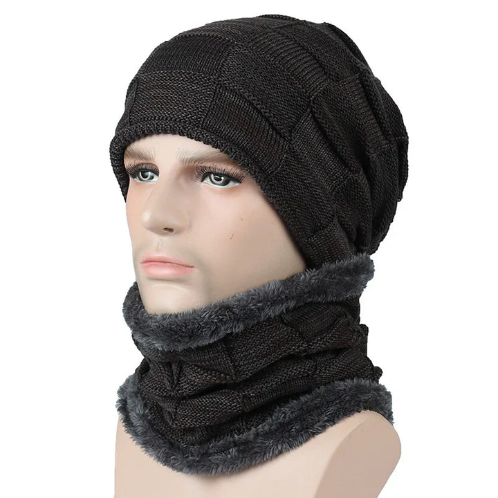 Black knitted winter beanie and matching neck warmer with gray faux fur trim on mannequin