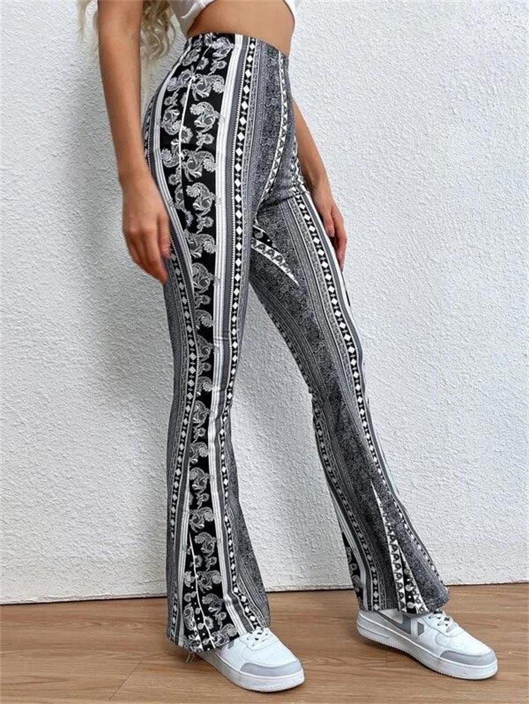 Woman wearing black and white patterned high-waist flare pants with white sneakers