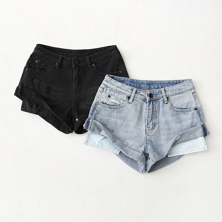 Pair of high-waisted denim shorts, one black distressed and one light blue rolled-hem