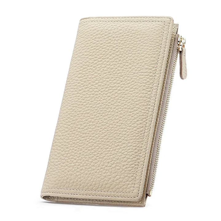 Beige textured leather wallet with zippered compartment and visible stitching on white background
