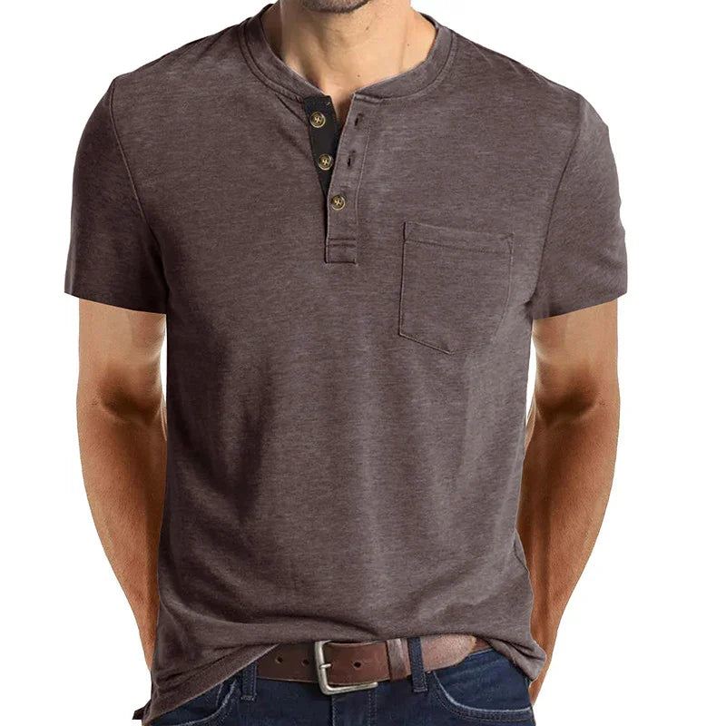 Men's short sleeve brown henley t-shirt with chest pocket and button placket, paired with belt and jeans