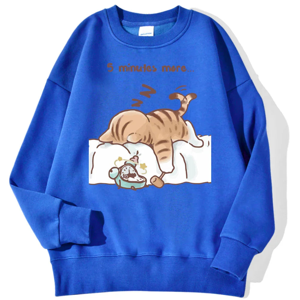 Blue sweatshirt with cartoon cat sleeping on bed and alarm clock, text saying '5 minutes more'