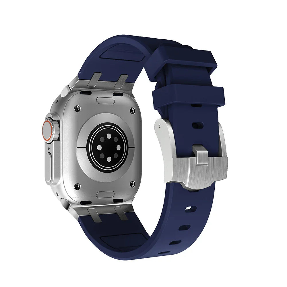 Back view of silver smartwatch with navy blue silicone strap and heart rate sensor
