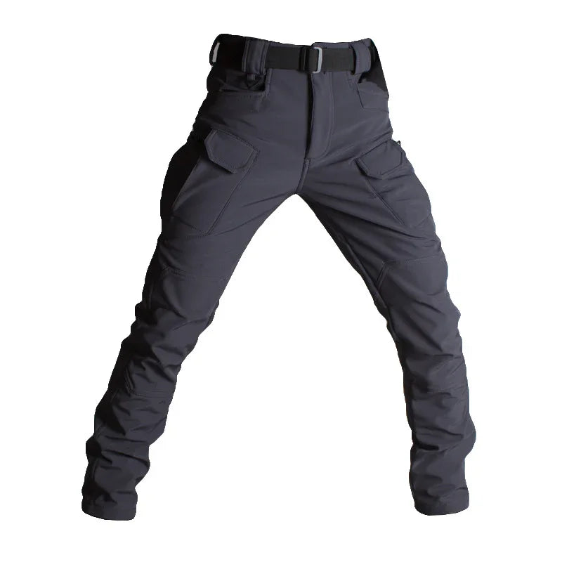 Black tactical cargo pants with multiple pockets and integrated belt on white background