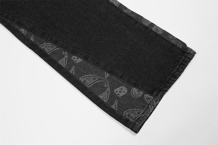 Black denim pant leg with paisley and skull print pattern on inner hem detail