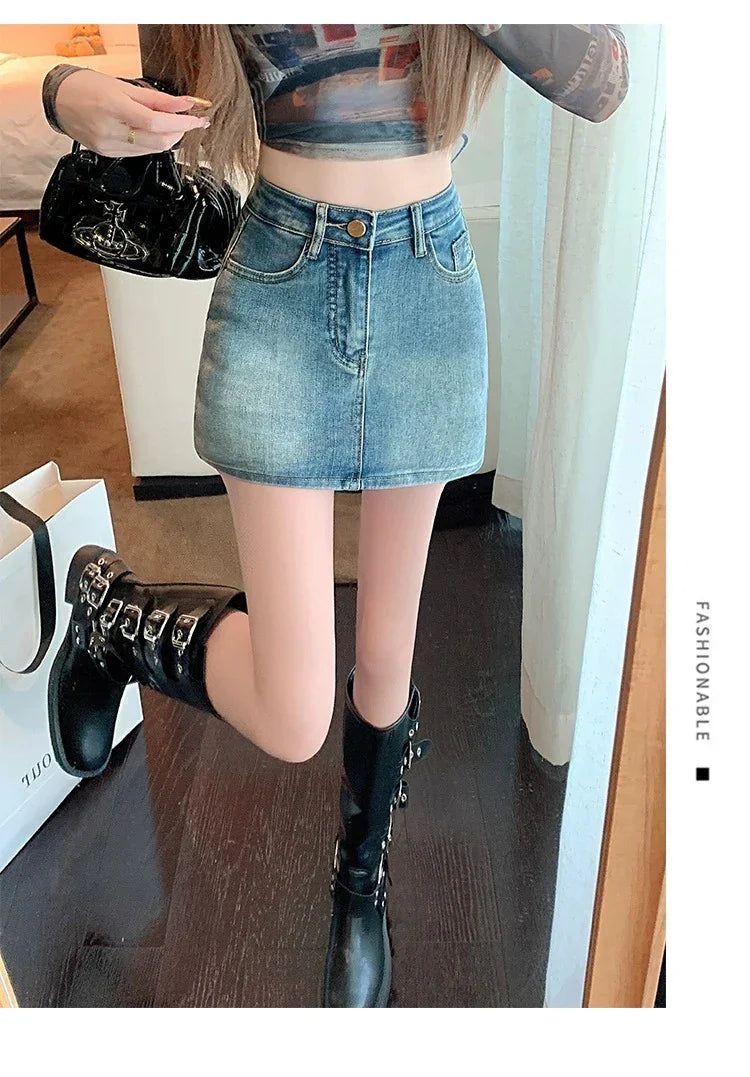 Woman wearing faded blue denim mini skirt with black buckled knee-high boots and patterned crop top