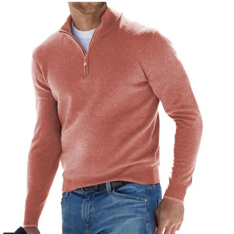 Men's coral pink quarter zip sweater paired with blue jeans and white undershirt