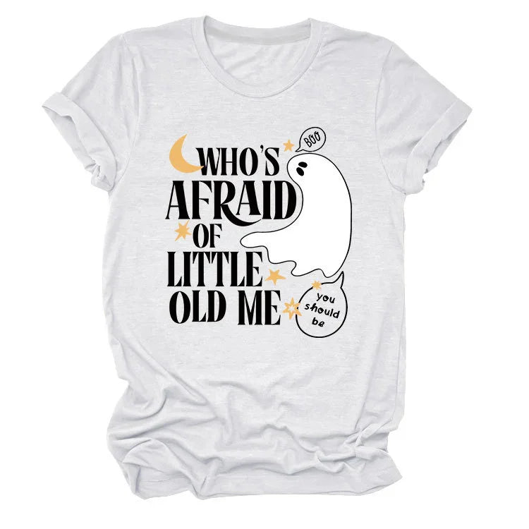 White t-shirt with Halloween ghost design and text 'Who's afraid of little old me' with stars and moon