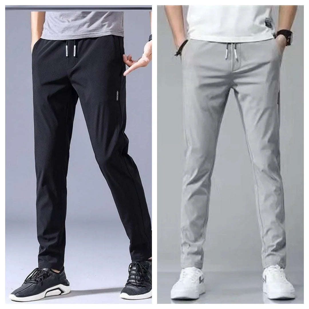 Men wearing casual slim fit jogger pants in black and light gray with sneakers