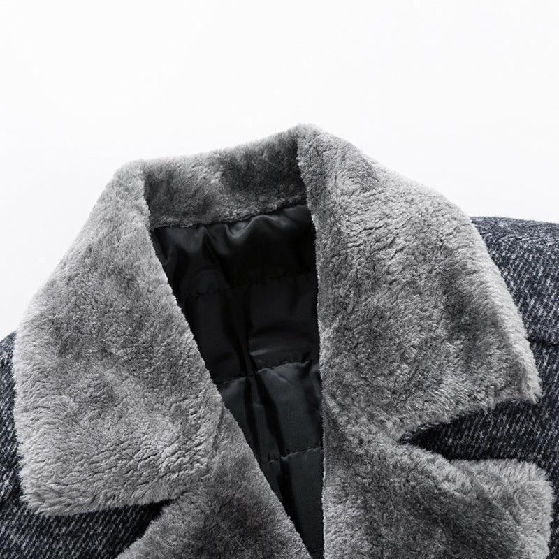 Close-up of gray faux fur collar on a black quilted jacket with textured fabric