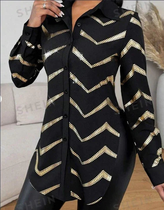 Black long-sleeve shirt with gold sequin chevron stripes worn by person indoors