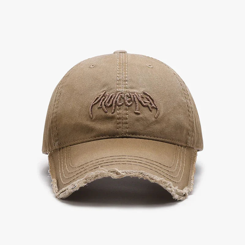 Beige distressed baseball cap with embroidered abstract logo on front