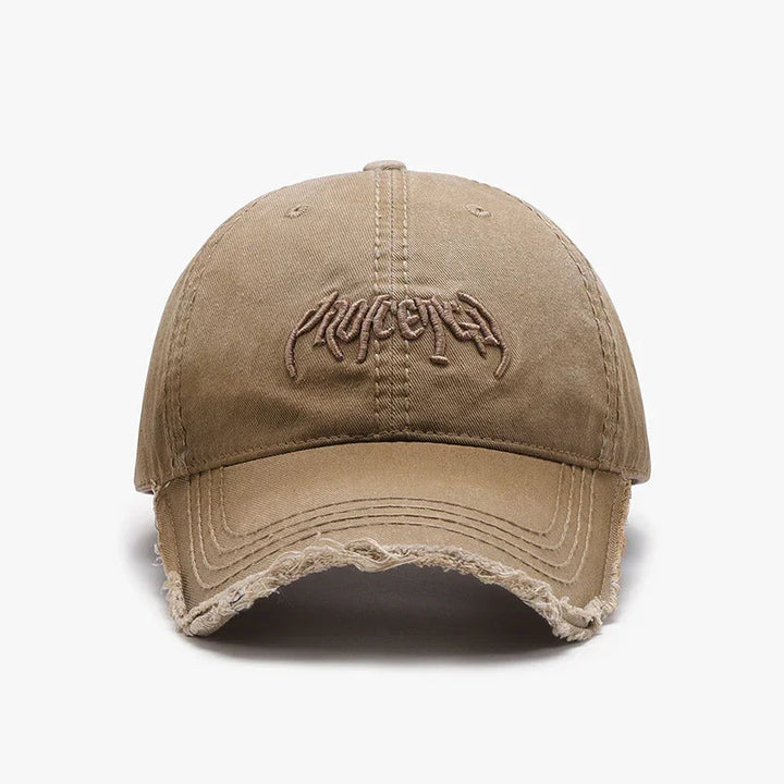 Beige distressed baseball cap with embroidered abstract logo on front