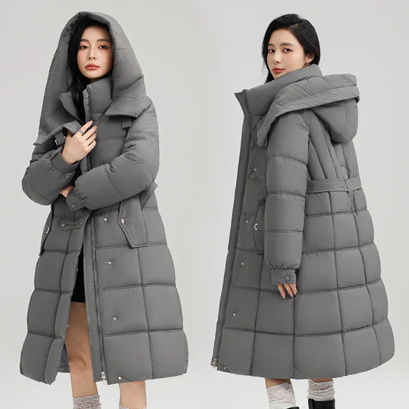 Woman wearing long gray padded winter coat with large hood, front and back views